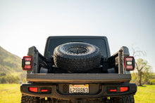 Load image into Gallery viewer, DV8 Offroad 2020+ Jeep Gladiator JT Adjustable In-Bed Tire Carrier
