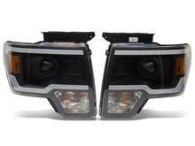 Load image into Gallery viewer, Raxiom 09-14 Ford F-150 Axial Series Projector Headlights w/ LED Light Bar- Blk Housing (Clear Lens) Headlights Raxiom
