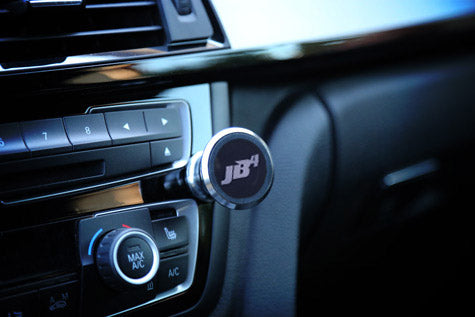 JB4 magnetic phone mount installed on car dashboard air vent by Burger Motorsports
