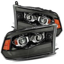 Load image into Gallery viewer, AlphaRex 09-18 Ram 1500HD LUXX Proj Headlight Plnk Style Jet Blk w/Activ Light/Seq Signal/Smoked DRL Headlights AlphaRex
