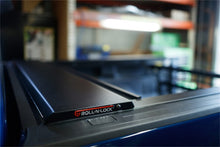 Load image into Gallery viewer, Roll-N-Lock 07-17 Toyota Tundra Crew Max Cab 65in E-Series Retractable Tonneau Cover Tonneau Covers - Retractable Roll-N-Lock

