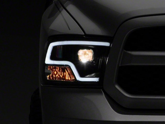 Raxiom 09-18 RAM 1500 LED Halo Projector Headlights- Black Housing (Clear Lens) Headlights Raxiom