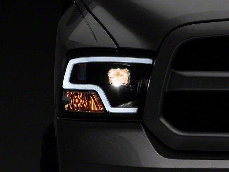 Raxiom 09-18 RAM 1500 LED Halo Projector Headlights- Black Housing (Clear Lens) Headlights Raxiom