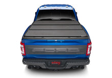 Load image into Gallery viewer, Extang 17-23 Nissan Titan w/o Rail Sys. (5ft. 7in. Bed) Solid Fold ALX Bed Covers - Folding Extang
