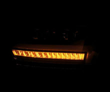 Load image into Gallery viewer, AlphaRex 19-20 Dodge Ram 1500 LUXX LED Proj Headlights Plank Jet Blk w/Activ Light/Seq Signal/DRL Headlights AlphaRex
