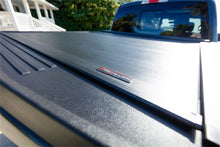 Load image into Gallery viewer, Roll-N-Lock 07-17 Toyota Tundra Crew Max Cab 65in E-Series Retractable Tonneau Cover Tonneau Covers - Retractable Roll-N-Lock
