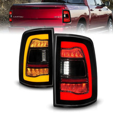 Load image into Gallery viewer, ANZO ANZ311472 ANZO 09-18 Dodge Ram 1500 Sequential LED Taillights Smoke Black w/Switchback Amber Signal
