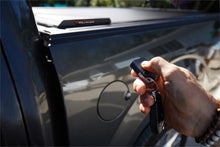 Load image into Gallery viewer, Roll-N-Lock 15-17 Chevy Silverado/Sierra 2500/3500 77-3/8in E-Series Retractable Tonneau Cover Tonneau Covers - Retractable Roll-N-Lock
