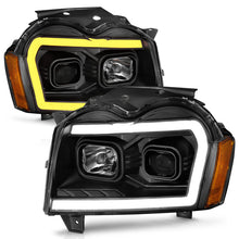 Load image into Gallery viewer, ANZO 2005-2007 Jeep Grand Cherokee Projector Headlights w/ Light Bar Switchback Black Housing Headlights ANZO
